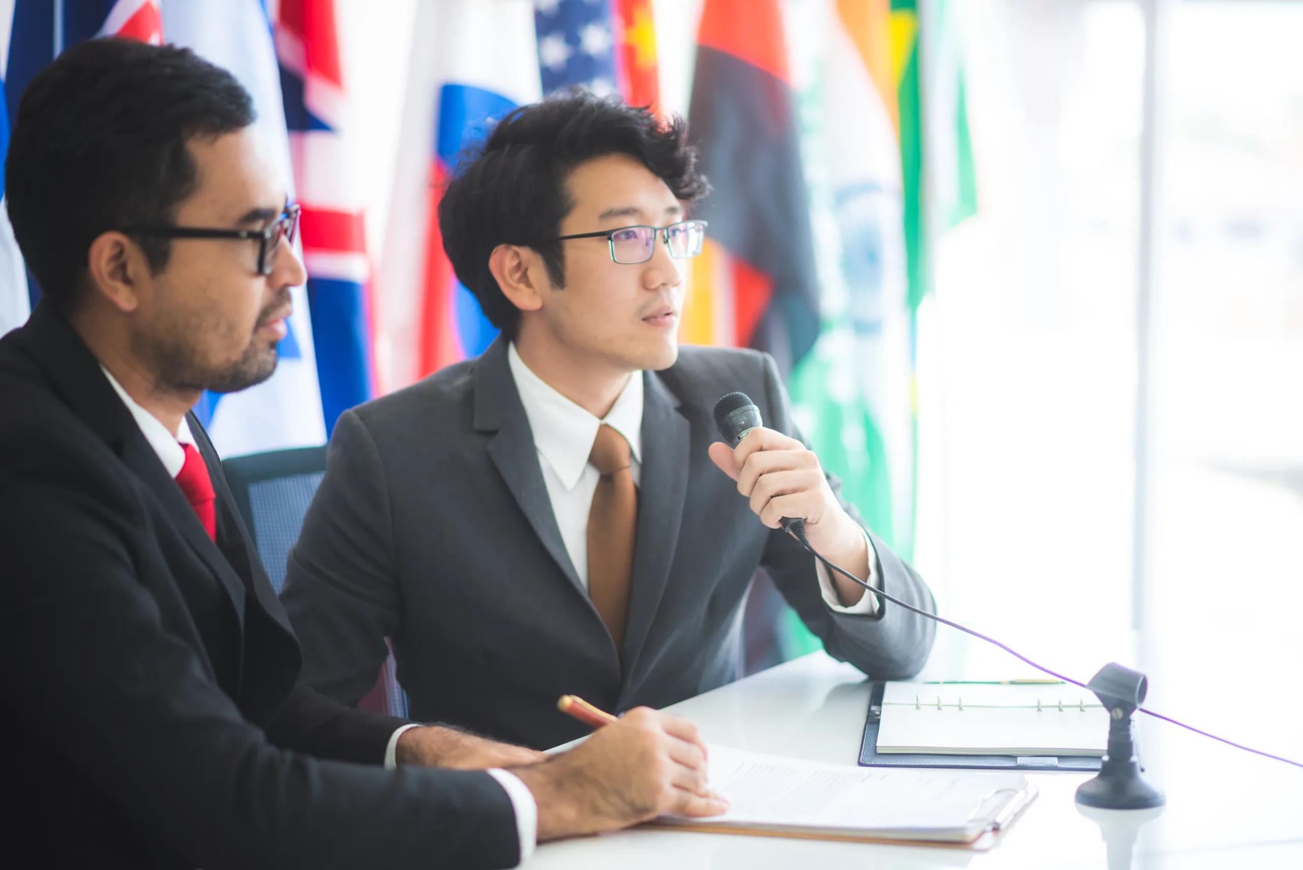 International,Businessmen,Make,A,Public,Statement,About,Diplomatic,Cooperation,To Diplomacy_2