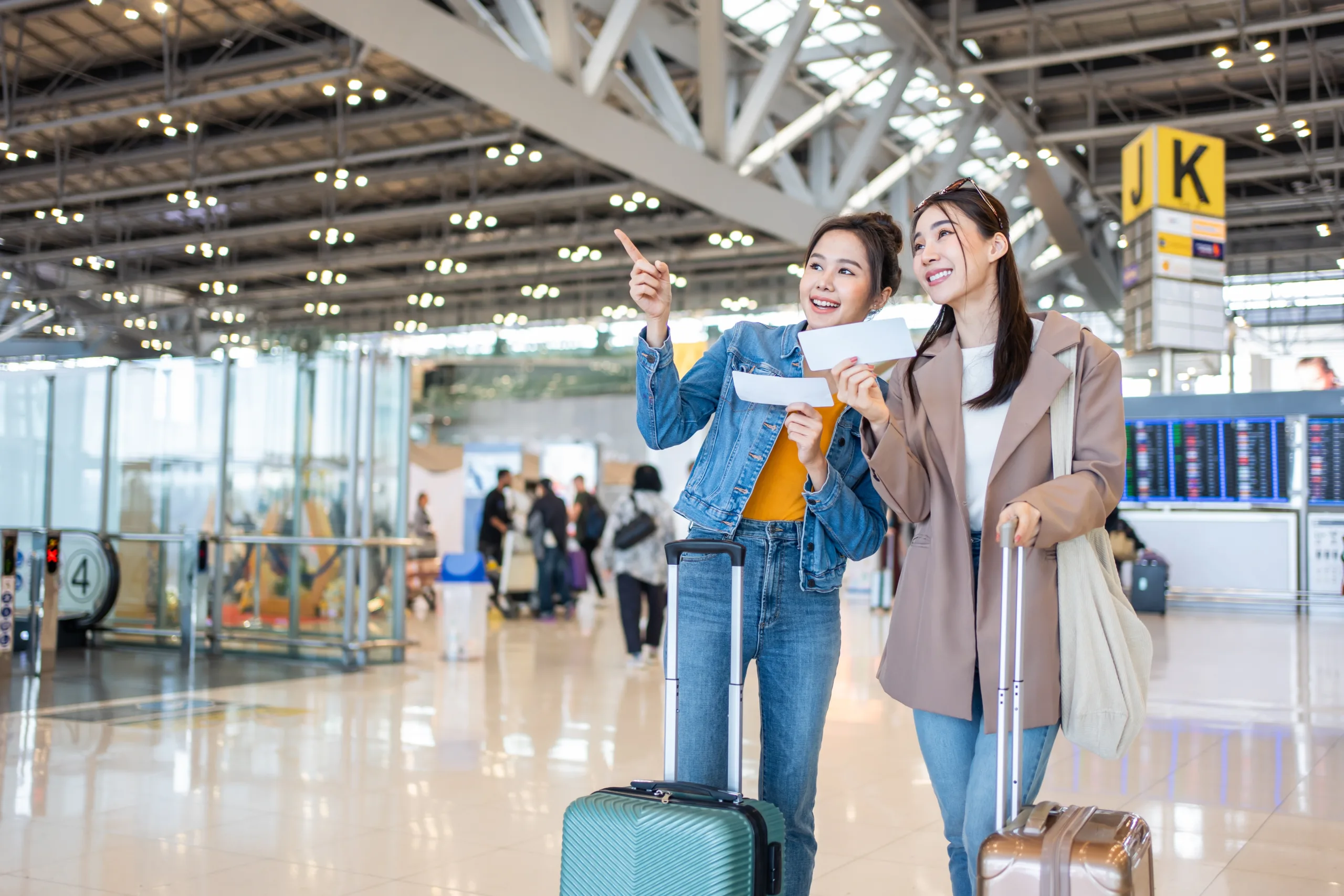 Asian,Young,Women,Passenger,Walk,In,Airport,Terminal,To,Boarding Tourism_2